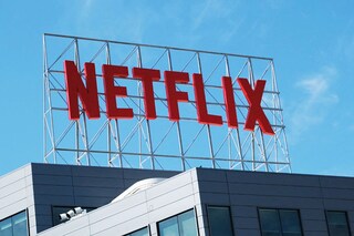 Netflix will work with Microsoft to launch a cheaper subscription plan that includes advertisements. Image: Chris DELMAS / AFP