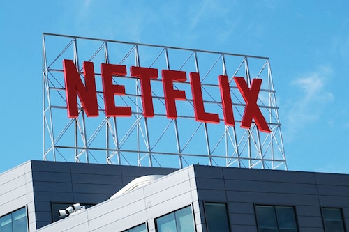 Netflix will work with Microsoft to launch a cheaper subscription plan that includes advertisements. Image: Chris DELMAS / AFP