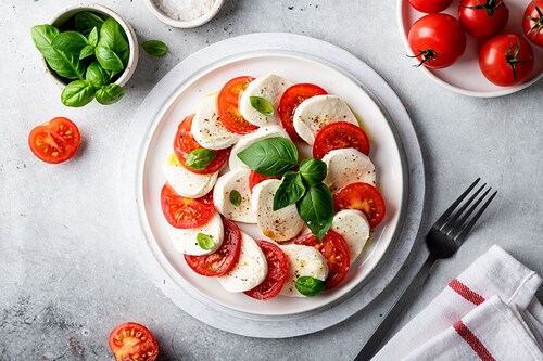 A tasty tomato-mozzarella salad could soon cost us more.
Image: Shutterstock A tasty tomato-mozzarella salad could soon cost us more.
Image: Shutterstock