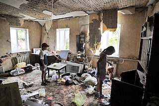 Children inspect a room damaged by the shelling in the town of Borodianka, near Kyiv on July 7, 2022. Image:&nbspSergei Chuzavkov / AFP