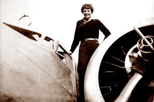 A May 20, 1937 photo shows US aviator Amelia Earhart on the wing of her Lockheed 10 Electra in Burbank, California. Image: Albert Bresnik / The Paragon Agency / AFP