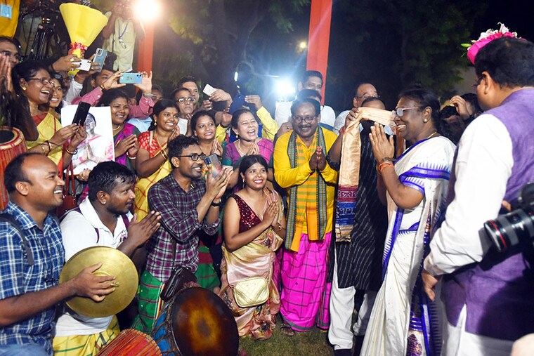 India"s President-elect Droupadi Murmu greets people from her village in Odisha on July 21, 2022, in New Delhi, India. 64-year-old Murmu, who defeated the opposition nominee Yashwant Sinha in the Presidential election, is the first person from Schedule Tribe and the second woman to become the nation"s First Citizen and the Supreme Commander of Indias Armed Forces.