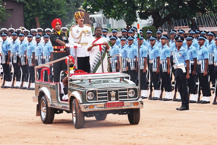 India"s newly elected President Droupadi Murmu inspects the guard of honour after taking her oath, in New Delhi, India, July 25, 2022.