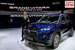 The managing director and chief executive officer of Maruti Suzuki India Limited (MSIL) Hisashi Takeuchi poses with the new  SUV Grand Vitara during its global unveiling ceremony in Gurgaon on July 20, 2022.
Image: Prakash Singh / AFP