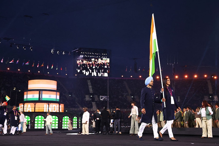 Flagbearers for India, Manpreet Singh and P V Sindhu lead India"s athletes in the Parade of Nations the opening ceremony for the Commonwealth Games at the Alexander Stadium in Birmingham, central England, on July 28, 2022.