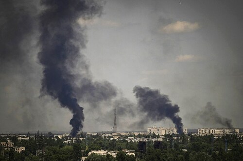 Smoke rises in the city of Severodonetsk during heavy fightings between Ukrainian and Russian troops at eastern Ukrainian region of Donbas on May 30, 2022, on the 96th day of the Russian invasion of Ukraine. EU leaders will try to overcome Hungary"s rejection of a Russian oil embargo on May 30, 2022 as part of a further tightening of sanctions against Moscow, whose forces are advancing in eastern Ukraine, with fighting in the heart of the key city of Severodonetsk. (Credits: ARIS MESSINIS / AFP) Smoke rises in the city of Severodonetsk during heavy fightings between Ukrainian and Russian troops at eastern Ukrainian region of Donbas on May 30, 2022, on the 96th day of the Russian invasion of Ukraine. EU leaders will try to overcome Hungary"s rejection of a Russian oil embargo on May 30, 2022 as part of a further tightening of sanctions against Moscow, whose forces are advancing in eastern Ukraine, with fighting in the heart of the key city of Severodonetsk. (Credits: ARIS MESSINIS / AFP)