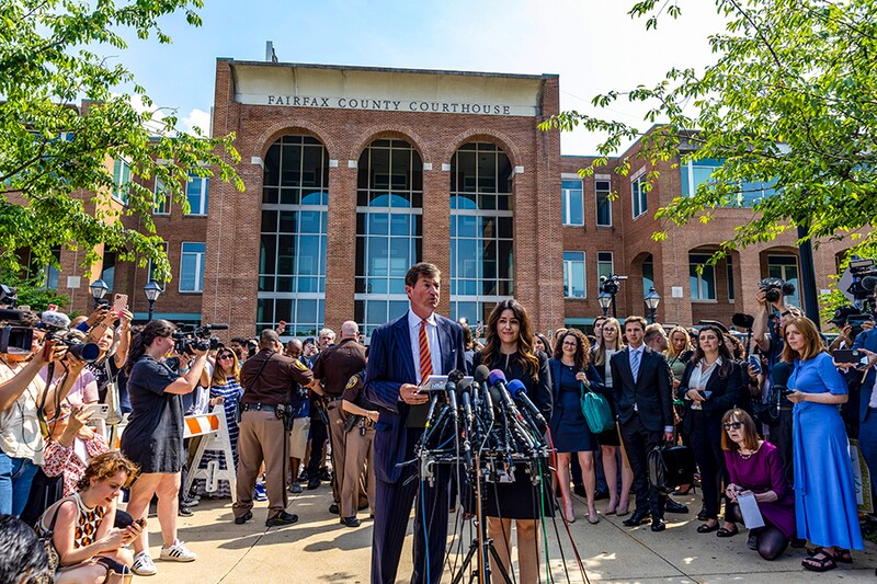 Ben Chew and Camille Vasquez, attorneys for US actor Johnny Depp, speak to reporters outside the Fairfax County Circuit Courthouse on June 01, 2022, in Fairfax, Virginia. A US jury found Wednesday that US actress Amber Heard had made defamatory claims of abuse against her ex-husband Johnny Depp, and awarded him $15 million in damages.