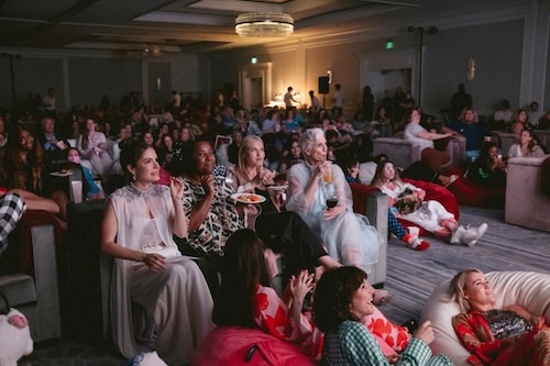 Tosca Musk and her mother Maye, right half of the couch, at the screening of a Passionflix show during PassionCon at the Ritz-Carlton Marina del Rey in Los Angeles, May 6, 2022. Tosca Musk, a younger sibling of multi-billionaire Elon Musk, is the force behind Passionflix, an upstart subscription streaming service dedicated to movie and series adaptations of mass-market romance novels and erotic fan fiction. Image: Mark Abramson/The New York Times Tosca Musk and her mother Maye, right half of the couch, at the screening of a Passionflix show during PassionCon at the Ritz-Carlton Marina del Rey in Los Angeles, May 6, 2022. Tosca Musk, a younger sibling of multi-billionaire Elon Musk, is the force behind Passionflix, an upstart subscription streaming service dedicated to movie and series adaptations of mass-market romance novels and erotic fan fiction. Image: Mark Abramson/The New York Times