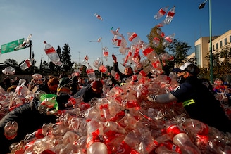 Garbage recyclers protest in front of Coca-Cola"s offices in demand for a recycling law that includes them and against funding for private recycling systems, in Buenos Aires, Argentina June 2, 2022.