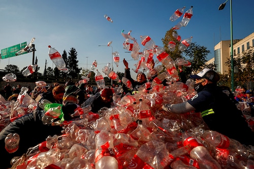 Garbage recyclers protest in front of Coca-Cola"s offices in demand for a recycling law that includes them and against funding for private recycling systems, in Buenos Aires, Argentina June 2, 2022.