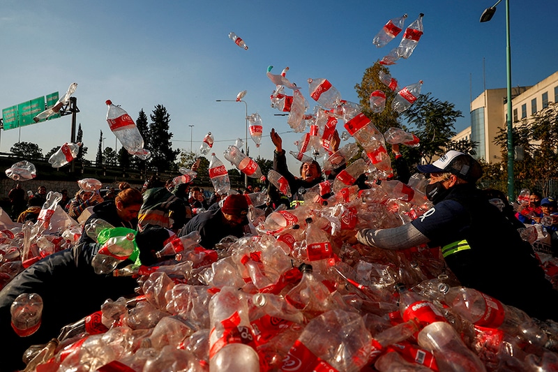 Garbage recyclers protest in front of Coca-Cola"s offices in demand for a recycling law that includes them and against funding for private recycling systems, in Buenos Aires, Argentina June 2, 2022.