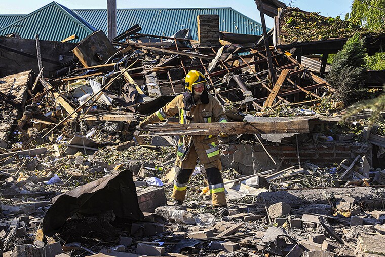 An emergency officer carries out work in a wrecked building after shelling amid Russian attacks on Ukraine in Kharkiv on June 09, 2022.