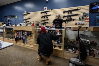 An customer browses guns at RTD Arms &amp Sport in Goffstown, New Hampshire on June 2, 2022. Smaller gun makers are booming in the US , thanks to ravenous and sometimes specialized demand for pricey limited-production pistols and custom rifles, engraved with bible passages or the US flag. The millions of guns produced annually in the US are primarily made by the nation"s biggest manufacturers, yet smaller operators have poured into a market that saw production nearly triple from 2000 to 2020. Image: Ed JONES / AFP