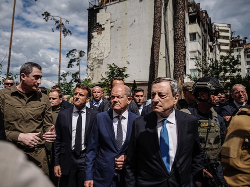 Irpin, Ukraine: (L to R) Oleksiy Chernyshov, Ukrainian President Zelensky"s special envoy for an EU accession perspective, walks with French President Emmanuel Macron, German Chancellor Olaf Scholz, and Italian Prime Minister Mario Draghi, past destroyed buildings in Irpin, Greater Kiev. Scholz, Macron and Draghi arrived in the Ukrainian capital of Kiev on Thursday morning. They will speak with Zelensky about further support for the country under attack from Russia.