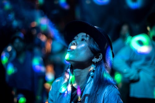"Rose K" smokes with a cannabidiol (CBD) vape during "Cannabis Open", an event to promote cannabidiol (CBD) products in Tokyo on June 12, 2022. CBD is legal in Japan if extracted from the plant"s seeds or fully-grown stems, but not other parts like the leaves. Image: Philip FONG / AFP