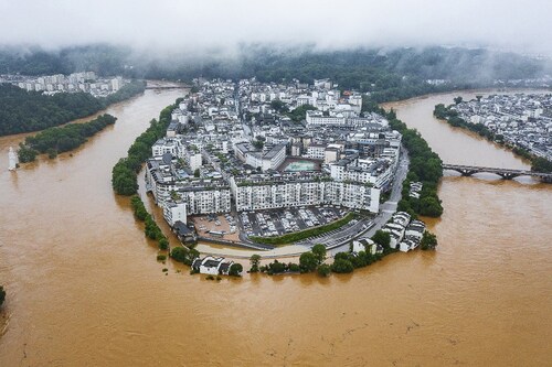 This aerial photo taken on June 20, 2022 shows flooded streets and buildings following heavy rains in Wuyuan, in China"s central Jiangxi province. Image:&nbspCNS / AFP