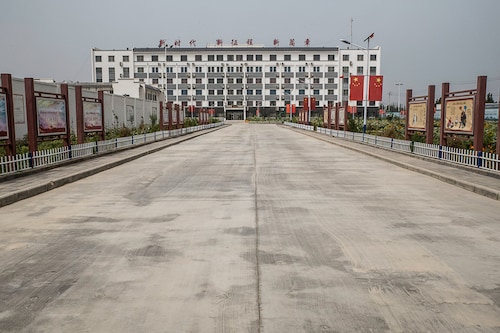 The entrance to an indoctrination center in Hotan, China on Aug. 4, 2019. In 2017, the regional government announced plans to transfer 100,000 people from the cities of Kashgar and Hotan in southern Xinjiang into new jobs. (Gilles Sabrie/The New York Times)