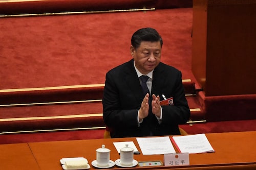 China"s President Xi Jinping applauds during the closing session of the National PeopleÃ­s Congress (NPC) at the Great Hall of the People in Beijing on March 11, 2022. Image: Leo RAMIREZ / AFP