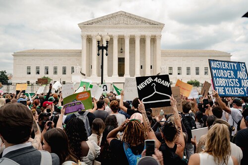 Abortion-rights demonstrators outside the U.S. Supreme Court after Roe v. Wade was overturned, in Washington, June 24, 2022. Reeling from competing demands from stakeholders, including activists, clients, consumers, shareholders and elected officials, businesses are increasingly caught in the middle of the country’s bruising culture wars. (Shuran Huang/The New York Times)