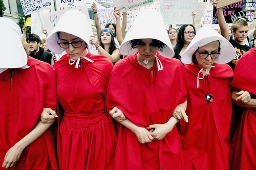 Abortion rights activists, dressed in an outfits from The Handmaid"s Tale, lead protestors during a march in Denver, Colorado on June 27, 2022, four days after the US Supreme Court struck down the right to abortion.
Image: Jason Connolly / AFP Abortion rights activists, dressed in an outfits from The Handmaid"s Tale, lead protestors during a march in Denver, Colorado on June 27, 2022, four days after the US Supreme Court struck down the right to abortion.
Image: Jason Connolly / AFP