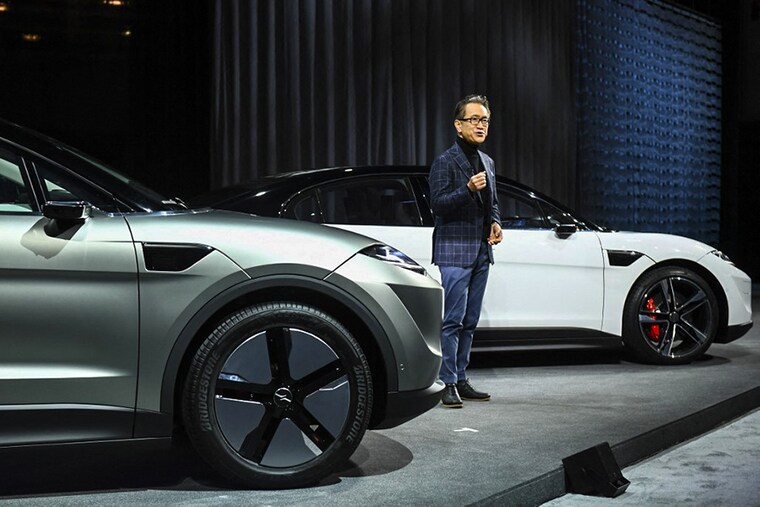 Sony chief executive officer Kenichiro Yoshida unveils the Sony Vision-S SUV prototype electric vehicle during the Sony press conference ahead of the Consumer Electronics Show (CES) on January 4, 2022 in Las Vegas, Nevada. - Sony unveiled a new prototype of its Vision-S electric vehicle and announced the founding of a company to explore jumping into the rapidly growing market.&nbsp(Photo by Patrick T. FALLON / AFP)
