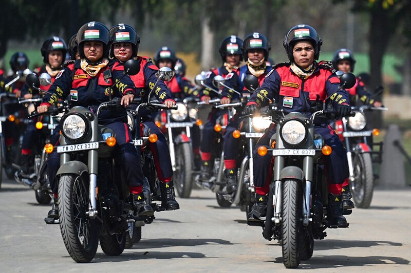 Indian Border Security Force (BSF) personnel from women"s motorcycle team "Sema Bhawani" ride their Royal Enfield motorcycles during the BSF Seema Bhawani Shaurya expedition-Empowerment Ride at India Gate in New Delhi on March 8, 2022, on the occasion of International Women"s Day.
