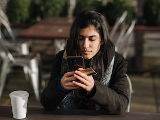 A woman checks her smartphone in a subway station in Moscow on May 7, 2020. The Russian government said Friday, Feb. 25, 2021, it was partially limiting access to Facebook for restricting some pro-Kremlin news media accounts, a move that could make it harder for Russians to share their anger over their country’s invasion of Ukraine. (The New York Times)
