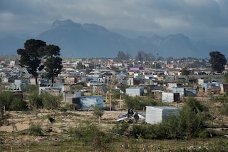 A general view shows the newly established informal settlement, as workers, begin demolishing uninhabited shacks in Bloekombos, Kraaifontein, in Cape Town.This land, due to be developed for civic amenities, for nearby communities, was illegally occupied by people, who marked out plots, and built informal dwellings. (Credit: RODGER BOSCH / AFP)