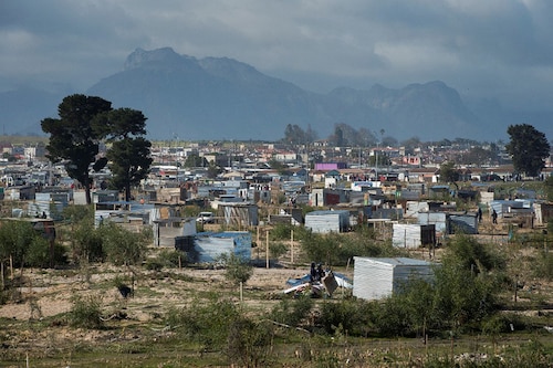 A general view shows the newly established informal settlement, as workers, begin demolishing uninhabited shacks in Bloekombos, Kraaifontein, in Cape Town.This land, due to be developed for civic amenities, for nearby communities, was illegally occupied by people, who marked out plots, and built informal dwellings. (Credit: RODGER BOSCH / AFP) A general view shows the newly established informal settlement, as workers, begin demolishing uninhabited shacks in Bloekombos, Kraaifontein, in Cape Town.This land, due to be developed for civic amenities, for nearby communities, was illegally occupied by people, who marked out plots, and built informal dwellings. (Credit: RODGER BOSCH / AFP)