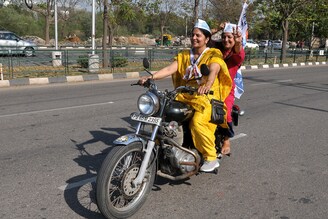 Aam Aadmi Party (AAP) supporters join a road show after the party"s victory in Punjab Assembly Election on March 10, 2022 in Mohali, India. Out of 117 seats, the Aam Aadmi Party won 92.