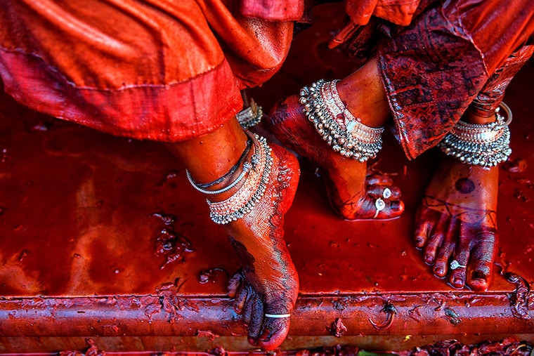 Ornaments adorn transgenders" feet at the Radharani Temple of Nandgaon during the celebrations marking Holi festival. Marking the beginning of spring, the festival celebrates the divine love of Radha and Krishna and represents the victory of good over evil.