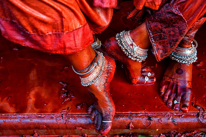 Ornaments adorn transgenders" feet at the Radharani Temple of Nandgaon during the celebrations marking Holi festival. Marking the beginning of spring, the festival celebrates the divine love of Radha and Krishna and represents the victory of good over evil.