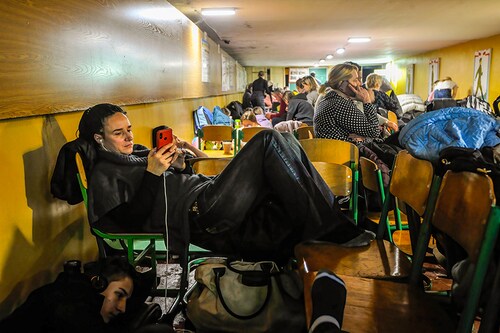 Women seen reading news at a bomb shelter in Kyiv. (Credit: Sergei Chuzavkov/SOPA Images/LightRocket via Getty Images)​ Women seen reading news at a bomb shelter in Kyiv. (Credit: Sergei Chuzavkov/SOPA Images/LightRocket via Getty Images)​