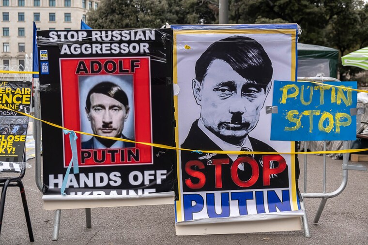 Posters depicting Russian President Vladimir Putin as Adolf Hitler are seen in Plaza Catalunya. There has been widespread opposition to Russia"s invasion of Ukraine, with protests taking place in many European cities. Image: Paco Freire/SOPA Images/LightRocket via Getty Images