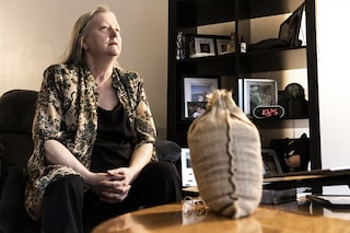 Cindy Armstrong is pictured with a bag containing the composted remains of her son Andrew Armstrong at her home in Covington, Washington on March 15, 2022. Armstrong recalled her son Andrew insisting on the so-called "terramation" process after the western state of Washington in 2019 became the first in the United States to make it a legal alternative to cremation. (Credit: Jason Redmond / AFP)