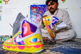 Haider Ali has transposed Pakistan"s renowned "truck art" onto sneakers
Image: Asif Hassan / AFP