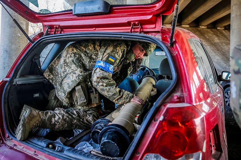 Tetiana Chornovol, a former member of the Ukrainian Parliament—now a service member and operator of an anti-tank guided missile weapon system—pulls an anti-tank missile out of a car at a position on the front line, amid Russia"s invasion of Ukraine, in the Kyiv region on March 20, 2022.