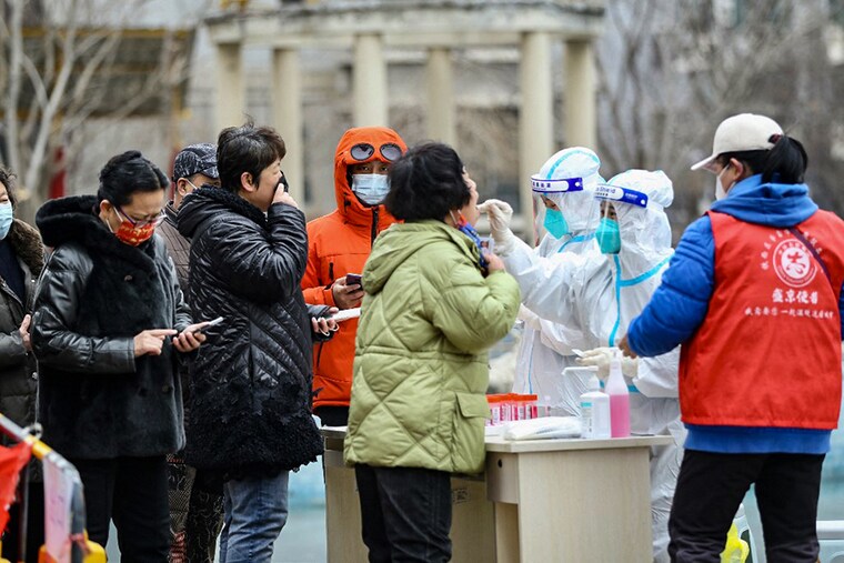 This photo taken on March 14, 2022 shows a resident underging a nucleic acid test for the Covid-19 coronavirus in Shenyang, in China"s northeastern Liaoning province. (Credit: AFP)