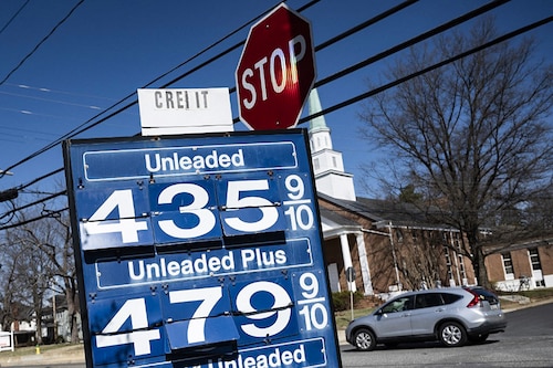 A car passes a gas station sign in Annapolis, Maryland, on March 14, 2022, as record high gas prices hit working class Americans with inflation already surging. (Photo by Jim WATSON / AFP) A car passes a gas station sign in Annapolis, Maryland, on March 14, 2022, as record high gas prices hit working class Americans with inflation already surging. (Photo by Jim WATSON / AFP)