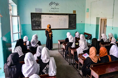 Girls attend a class after their school reopened in Kabul on March 23, 2022. - The reopening of secondary schools for girls across Afghanistan on March 23 prompted joy and apprehension among the tens of thousands of students deprived of an education since the Taliban"s return to power. (Credit: Ahmad SAHEL ARMAN / AFP) Girls attend a class after their school reopened in Kabul on March 23, 2022. - The reopening of secondary schools for girls across Afghanistan on March 23 prompted joy and apprehension among the tens of thousands of students deprived of an education since the Taliban"s return to power. (Credit: Ahmad SAHEL ARMAN / AFP)