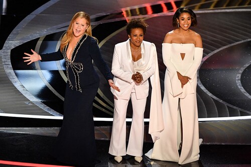 US actress and comedian Amy Schumer (L), US actress and comedian Wanda Sykes (C) and US actress Regina Hall speak onstage during the 94th Oscars at the Dolby Theatre in Hollywood, California on March 27, 2022.
Image: Robyn Beck / AFP US actress and comedian Amy Schumer (L), US actress and comedian Wanda Sykes (C) and US actress Regina Hall speak onstage during the 94th Oscars at the Dolby Theatre in Hollywood, California on March 27, 2022.
Image: Robyn Beck / AFP