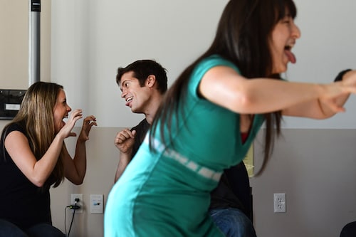 A file photo of laughing yoga therapy run by instructor Helen Fong (right) at InteRACT, an intensive, adult aphasia program with speech and language therapy. Laughing yoga is induced, voluntary laughter believed to have therapeutic benefits for mind and body after prolonged, stressful situations. (Credit: Linda Davidson / The Washington Post via Getty Images) A file photo of laughing yoga therapy run by instructor Helen Fong (right) at InteRACT, an intensive, adult aphasia program with speech and language therapy. Laughing yoga is induced, voluntary laughter believed to have therapeutic benefits for mind and body after prolonged, stressful situations. (Credit: Linda Davidson / The Washington Post via Getty Images)