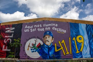 A mural depicting president Daniel Ortega in EstelÃ­, Nicaragua, on July 2, 2021. The slogan at top is a quotation from the 19th century Nicaraguan poet RubÃ©n Dario and reads “Here we are illuminated by a sun that does not decline.â€ (Inti Ocon/The New York Times)