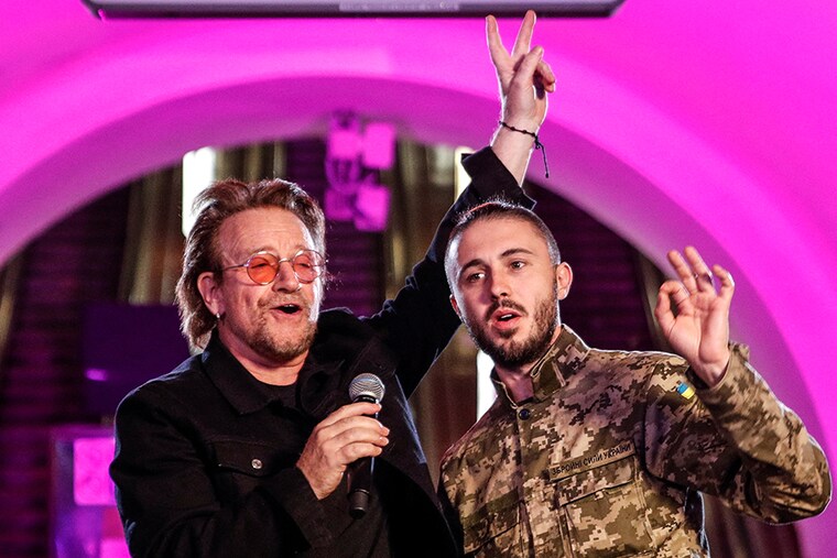 U2 frontman Bono and Ukrainian serviceman, frontman of the Antytila band Taras Topolia, sing during a performance for Ukrainian people inside a subway station, as Russia"s attack on Ukraine continues, in Kyiv, Ukraine on May 8, 2022.