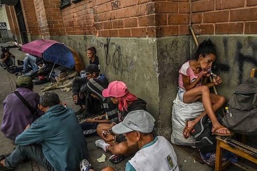 Drug addicts smoke basuco, a highly addictive drug consisting of low-grade cocaine mixed with coca paste and other substances, in downtown Medellin, Colombia, on February 28, 2022. Three decades after Pablo Escobar"s shot body was left on a Medellin rooftop, drug trafficking continues and, at present, markets for flavored cocaine, local crack, pharmaceutical drugs and ketamine-based hallucinogens are rife for in his hometown. (Credits: JOAQUIN SARMIENTO / AFP) Drug addicts smoke basuco, a highly addictive drug consisting of low-grade cocaine mixed with coca paste and other substances, in downtown Medellin, Colombia, on February 28, 2022. Three decades after Pablo Escobar"s shot body was left on a Medellin rooftop, drug trafficking continues and, at present, markets for flavored cocaine, local crack, pharmaceutical drugs and ketamine-based hallucinogens are rife for in his hometown. (Credits: JOAQUIN SARMIENTO / AFP)