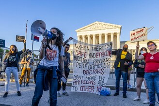 Callie Lowenstein speaks at an abortion-rights protest in front of the U.S. Supreme Court building on May 10, 2022, in Washington, DC. Senate Democrats plan to take up a bill on May 11 that would codify abortion rights in federal law, but it is all but certain to come up short of the 60 votes needed to overcome a Republican filibuster.