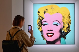 In this file photo taken on April 29, 2022 a woman takes a photo of Andy Warhol"s "Shot Sage Blue Marilyn" during Christie"s 20th and 21st Century Art press preview at Christie"s New York in New York City. - An iconic portrait of Marilyn Monroe by American pop art visionary Andy Warhol went under the hammer for a record $195 million on May 9, 2022 at Christie"s, becoming the most expensive 20th century artwork ever sold at public auction.
"Shot Sage Blue Marilyn," produced in 1964 two years after the death of the glamourous Hollywood star, sold for exactly $195.04 million, including fees, in just four minutes in a crowded room at Christie"s headquarters in Manhattan. (Photo by Angela Weiss / AFP)