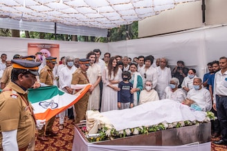 Santoor maestro Pandit Shivkumar Sharma is laid to rest as flautist Pandit Hariprasad Chaurasia and others look on before the funeral at Sharma"s Juhu residence on May 11, 2022, in Mumbai, India. As a music composer, Pandit Sharma collaborated with Pandit Chaurasia under the collaborative name Shiv-Hari and composed music for many Indian films including Faasle (1985), Chandni (1989), Lamhe (1991) and Darr (1993).