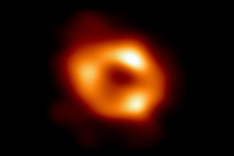 An image provided by the Event Horizon Collaboration and the National Science Foundation shows the first direct image of Sagittarius A*, the black hole at the center of the Milky Way. Astronomers announced on Thursday, May 12, 2022, that they had pierced the veil of darkness and dust at the center of our Milky Way galaxy to capture the first picture of “the gentle giantâ€ dwelling there: a supermassive black hole, a trapdoor in space-time through which the equivalent of four million suns have been dispatched to eternity, leaving behind only their gravity and violently bent space-time. Image: Event Horizon Collaboration/National Science Foundation via The New York Times