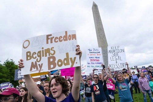 Abortion rights activist rally at the Washington Monument before marching to the US Supreme Court in Washington, DC, May 14, 2022. Thousands of activists are participating in a national day of action calling for safe and legal access to abortion. The nationwide demonstrations are a response to leaked draft opinion showing the US Supreme Court"s conservative majority is considering overturning Roe v. Wade, the 1973 ruling guaranteeing abortion access. (Credits: Jose Luis Magana / AFP)